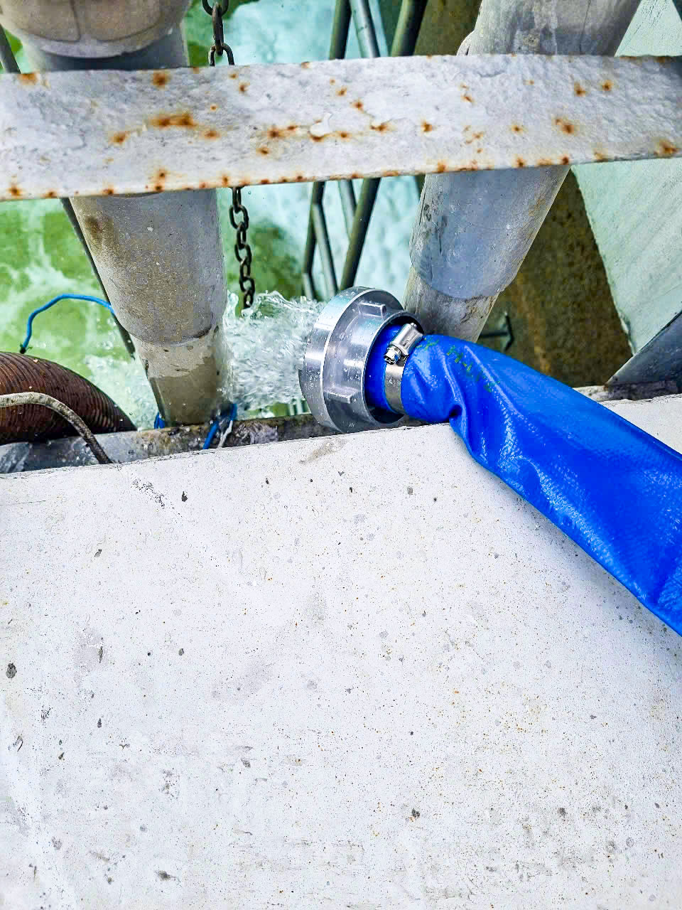 Blue discharge hose and coupling in HCP’s Yakult factory drainage report